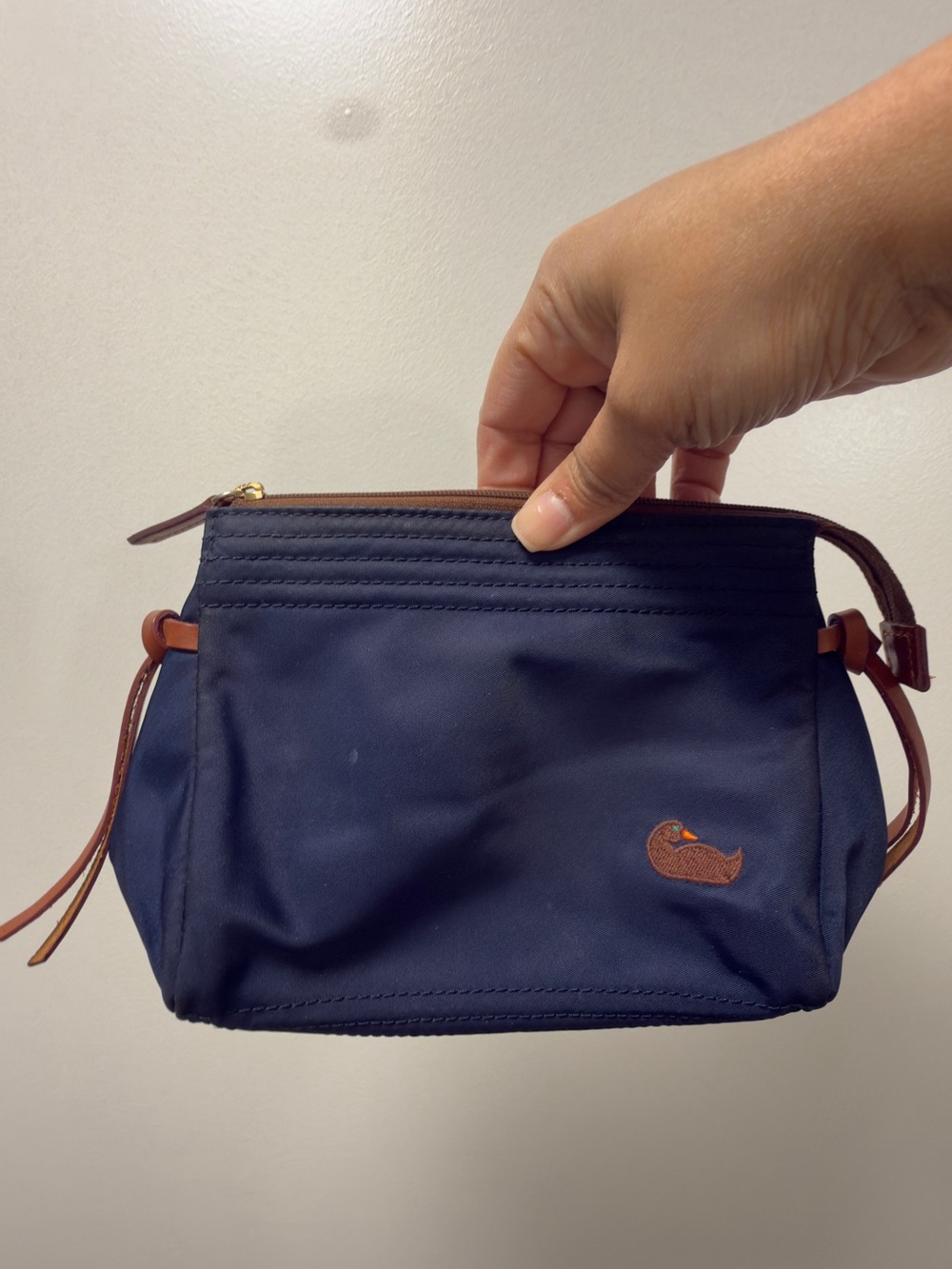 Dooney & Bourke Navy Cosmetic Wristlet with Brown Trim